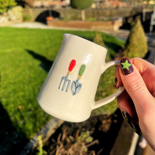 Ceramic Milk Jug With Embossed Gardeners Design